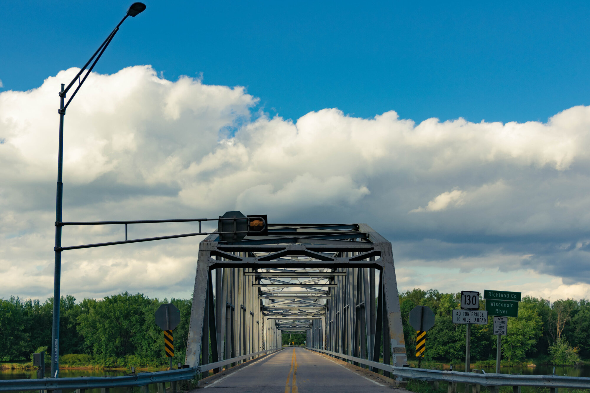 Taken on 09/05/22, this bridge was demolished 3 months later. A bridge spanning the Wisconsin River at the old junction of State Route 133 and State Route 130, just south of Lone Rock, WI.